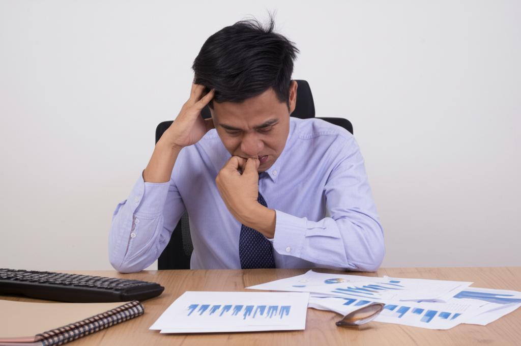man feeling stressed and worried about performance